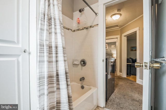 bathroom with crown molding and shower / tub combo with curtain