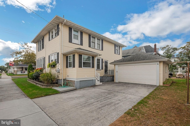 view of front of house with a front yard and a garage