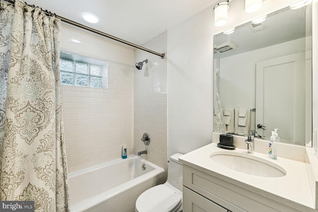 full bathroom with toilet, vanity, and shower / bath combination with curtain