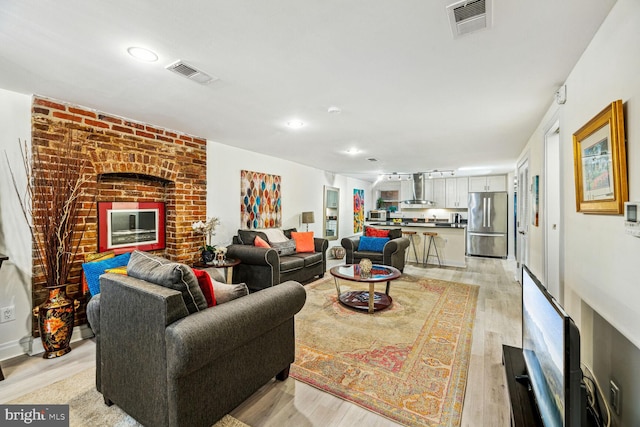 living room with light hardwood / wood-style floors