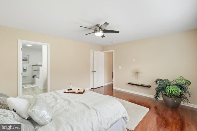 bedroom featuring connected bathroom, wood-type flooring, and ceiling fan