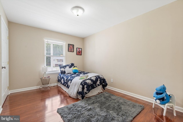 bedroom with hardwood / wood-style floors