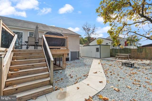 back of house featuring an outdoor fire pit