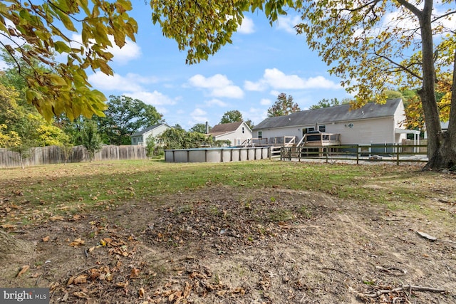 view of yard with a fenced in pool