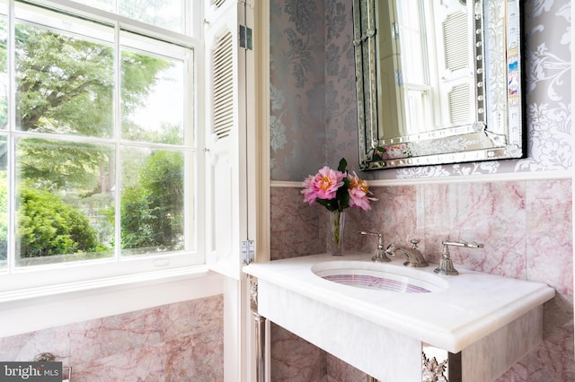 bathroom featuring sink and a wealth of natural light