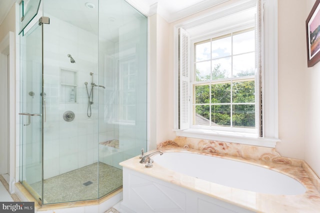 bathroom featuring crown molding, a wealth of natural light, and plus walk in shower