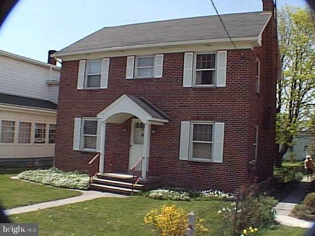 colonial house with a front lawn