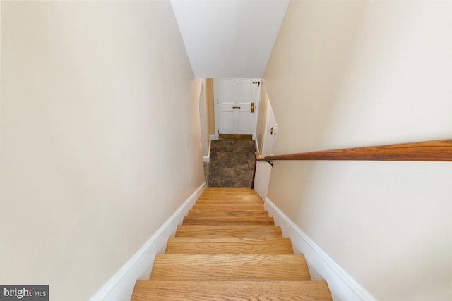 stairway featuring hardwood / wood-style flooring