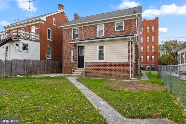 view of front of home with a front lawn