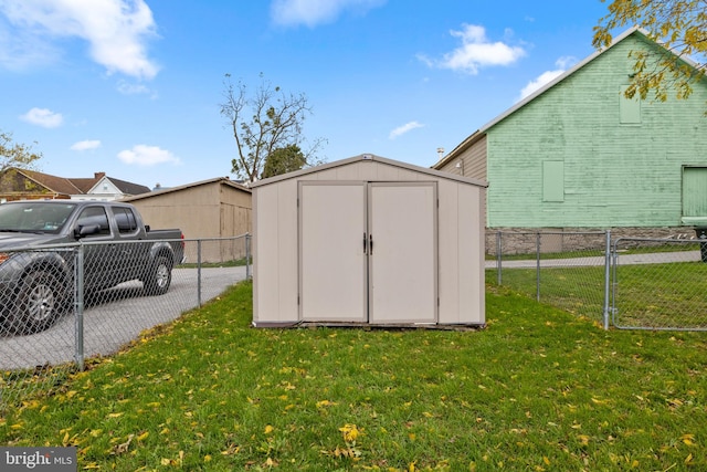 view of outbuilding featuring a yard