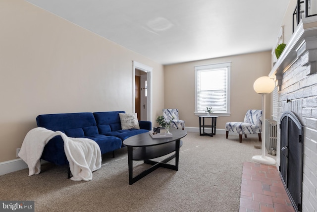 carpeted living room with a brick fireplace