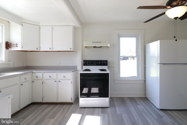 kitchen with white cabinets, white appliances, light hardwood / wood-style floors, and ceiling fan