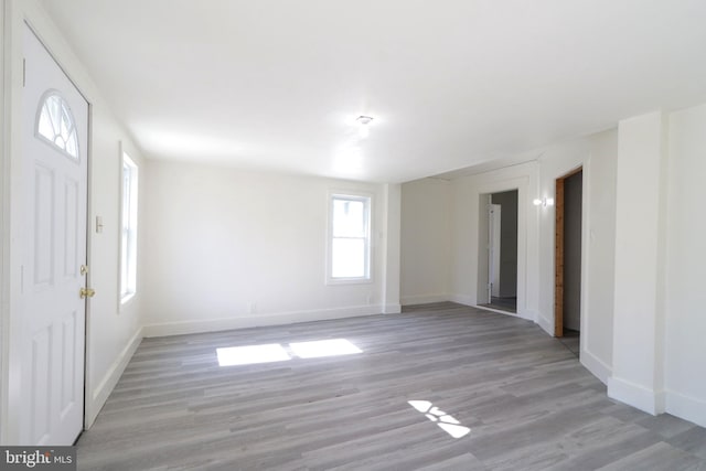 foyer with light hardwood / wood-style floors