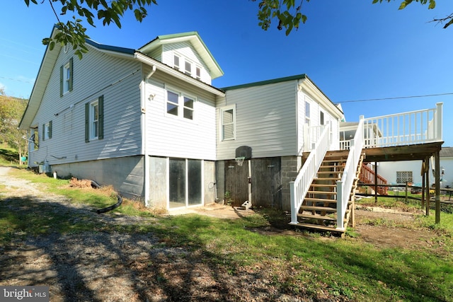 rear view of property with a deck