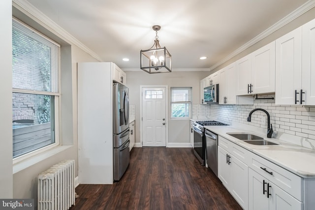 1715 N Felton St, Philadelphia, PA 19151 - kitchen with a notable chandelier, a sink, light countertops, appliances with stainless steel finishes, and radiator heating unit