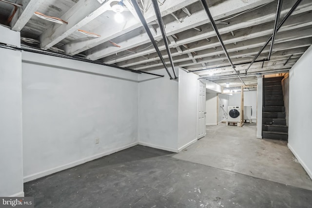 1715 N Felton St, Philadelphia, PA 19151 - unfinished below grade area featuring washer / clothes dryer, baseboards, and stairs