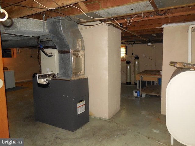 interior space featuring heating unit and washer / dryer