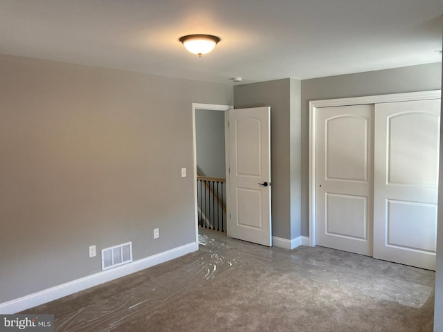 unfurnished bedroom with a closet