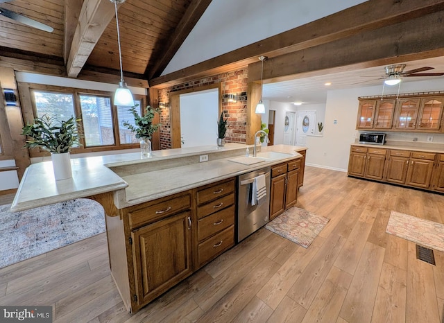 kitchen with a large island, dishwasher, light hardwood / wood-style flooring, and sink