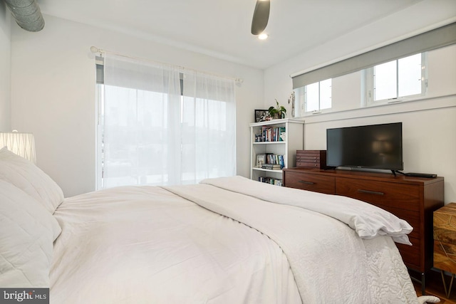 bedroom with hardwood / wood-style flooring and ceiling fan