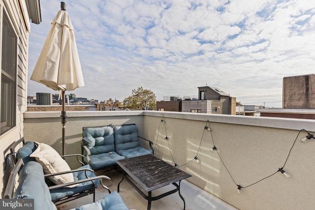 view of patio featuring a balcony