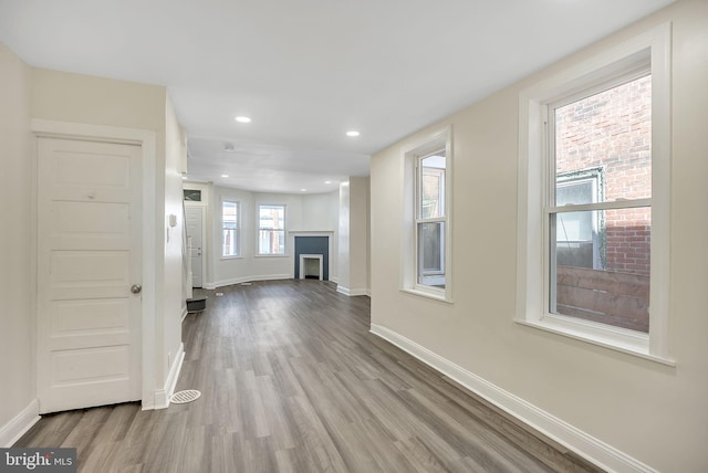 unfurnished living room with light hardwood / wood-style floors