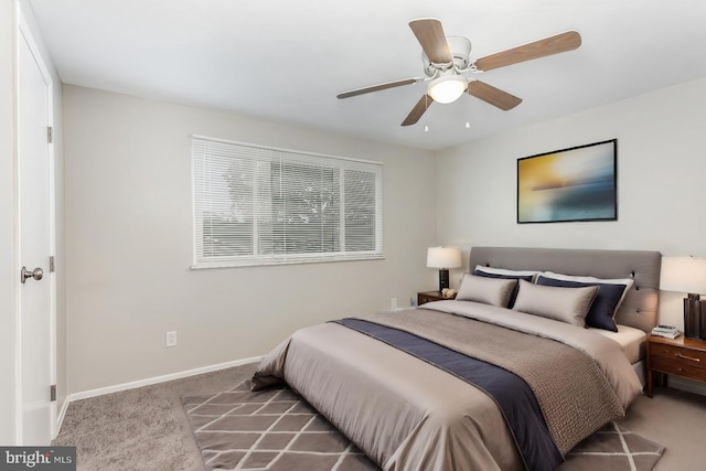 carpeted bedroom featuring ceiling fan