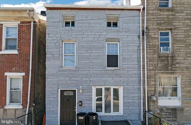 view of front of home featuring cooling unit