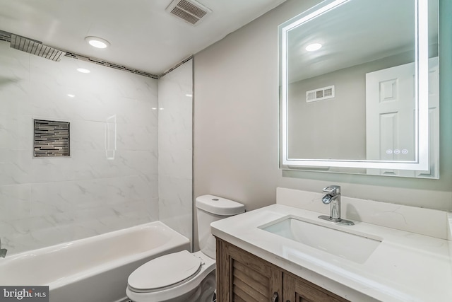 full bathroom featuring vanity, toilet, and tiled shower / bath