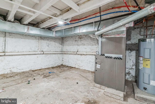 basement featuring water heater and heating unit