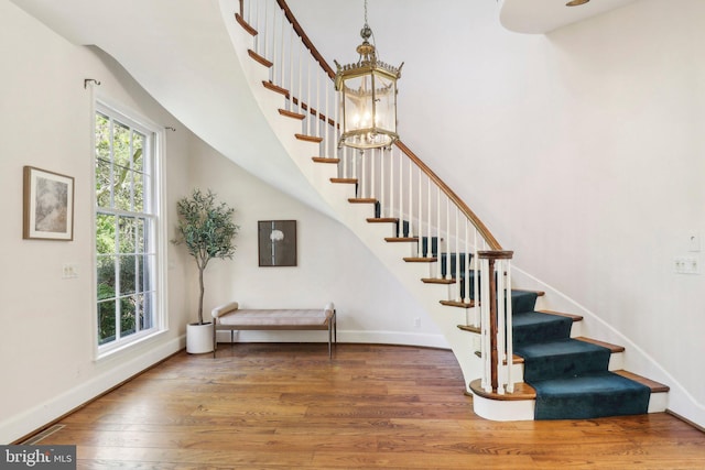 staircase featuring hardwood / wood-style flooring