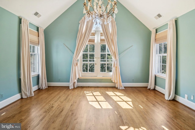 bonus room featuring lofted ceiling and light hardwood / wood-style flooring