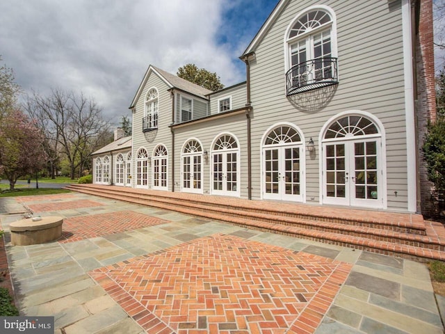 rear view of house with a patio and french doors