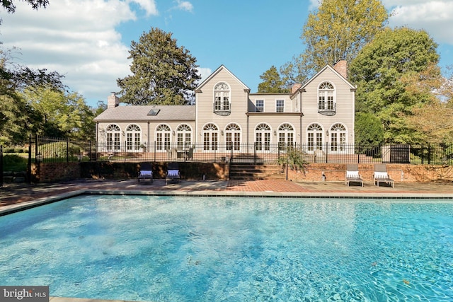 view of pool featuring a patio