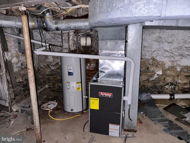 utility room featuring water heater