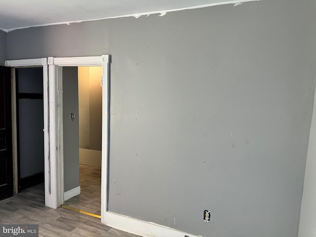 unfurnished bedroom featuring wood-type flooring