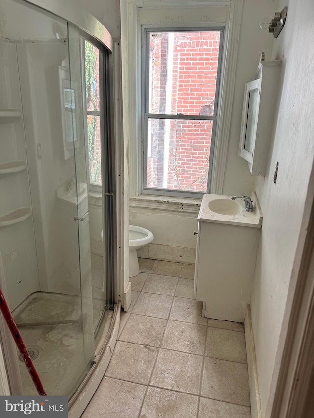 bathroom with vanity, toilet, walk in shower, and a wealth of natural light