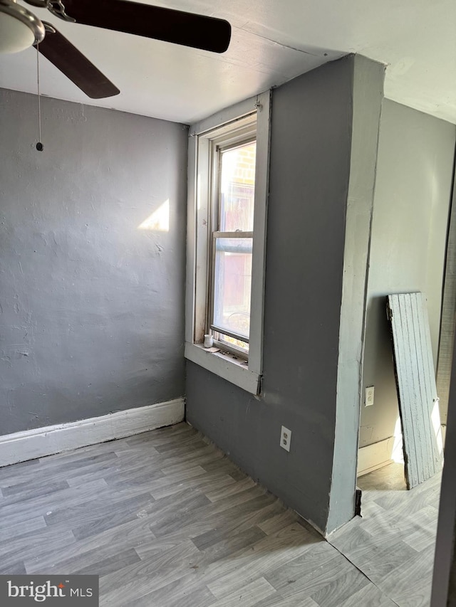 spare room with ceiling fan and light hardwood / wood-style flooring