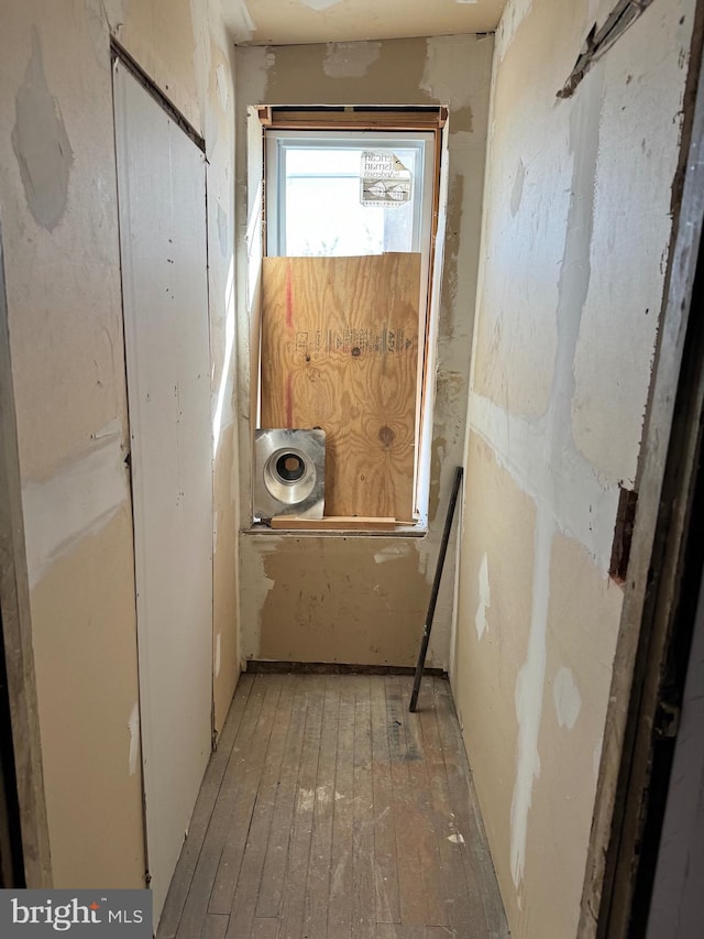 corridor with light wood-type flooring