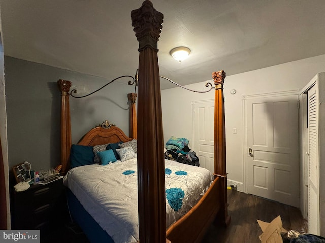 bedroom featuring dark hardwood / wood-style flooring