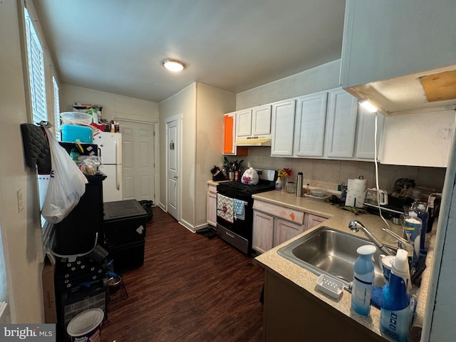 kitchen with dark wood-type flooring, stainless steel range with electric cooktop, white cabinetry, and white refrigerator