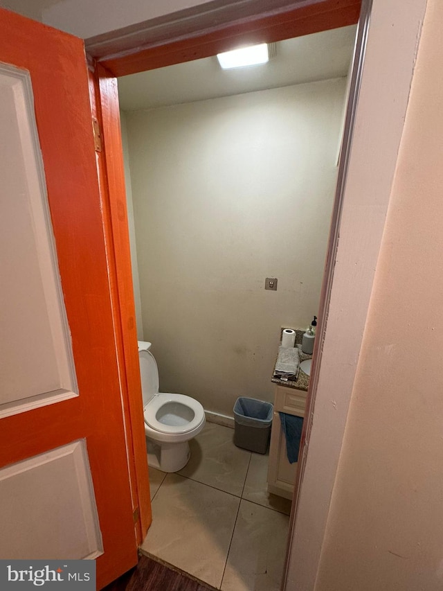 bathroom featuring tile patterned floors and toilet