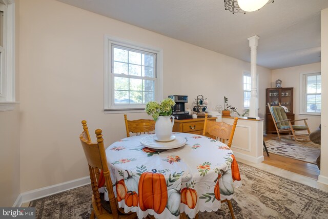 dining area featuring wood-type flooring