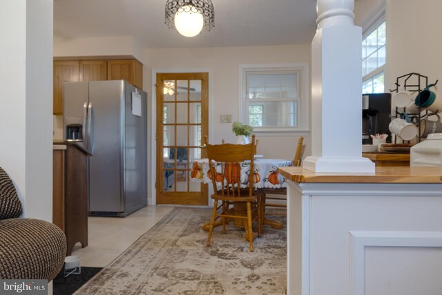 dining space featuring ornate columns