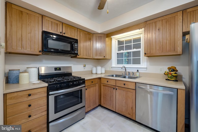 kitchen with ceiling fan, appliances with stainless steel finishes, and sink