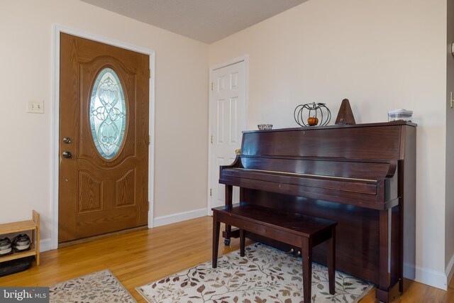 foyer with light hardwood / wood-style floors