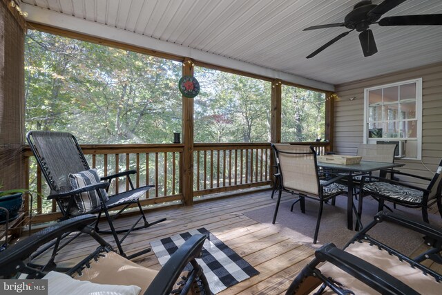 wooden terrace featuring ceiling fan