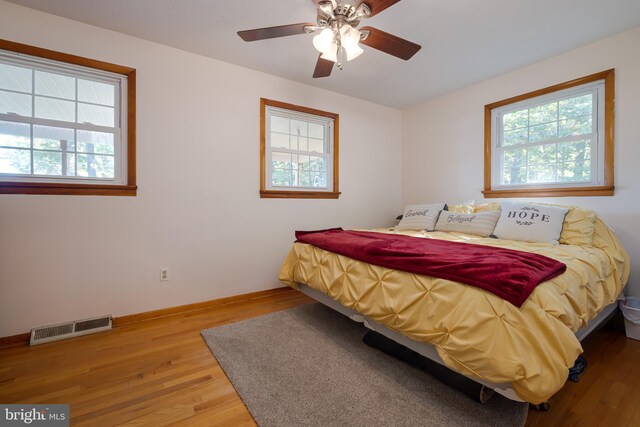 bedroom featuring wood-type flooring and ceiling fan