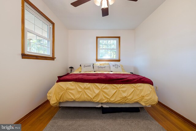 bedroom featuring hardwood / wood-style flooring and ceiling fan