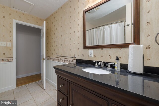 bathroom featuring tile patterned floors and vanity